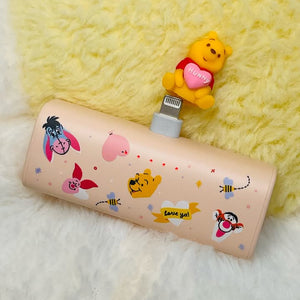Cartoon-themed power bank with character design on a soft yellow background