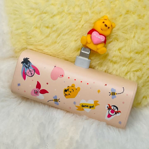 Cartoon-themed power bank with character design on a soft yellow background
